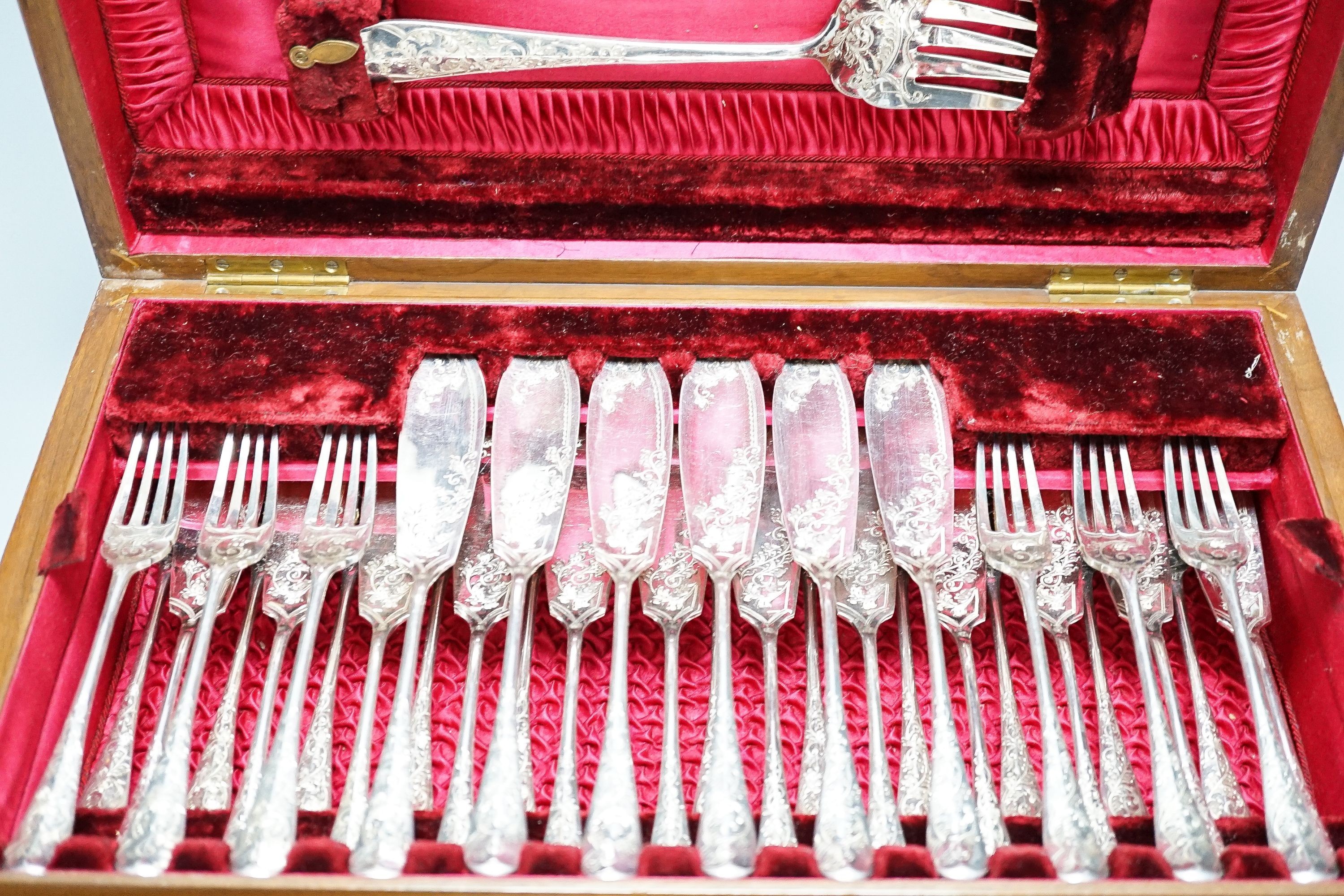 A cased set of plated engraved fish cutlery